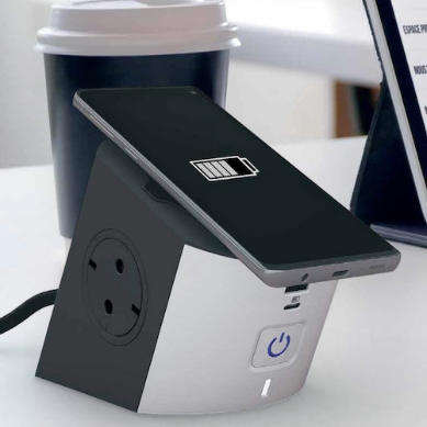 A phone rests on the Multi-Outlet. The tilted surface allows for keeping up with messages while your phone charges.